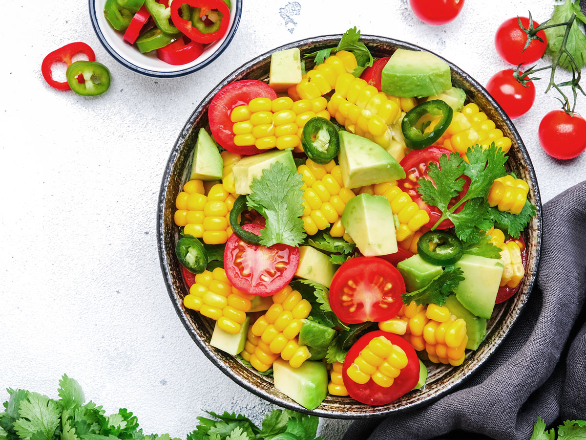 Sweet corn and avocado salad with tomato, jalapeños and cilantro